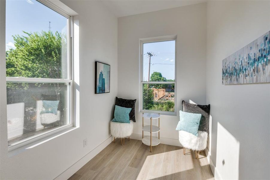 Living space with light hardwood / wood-style floors