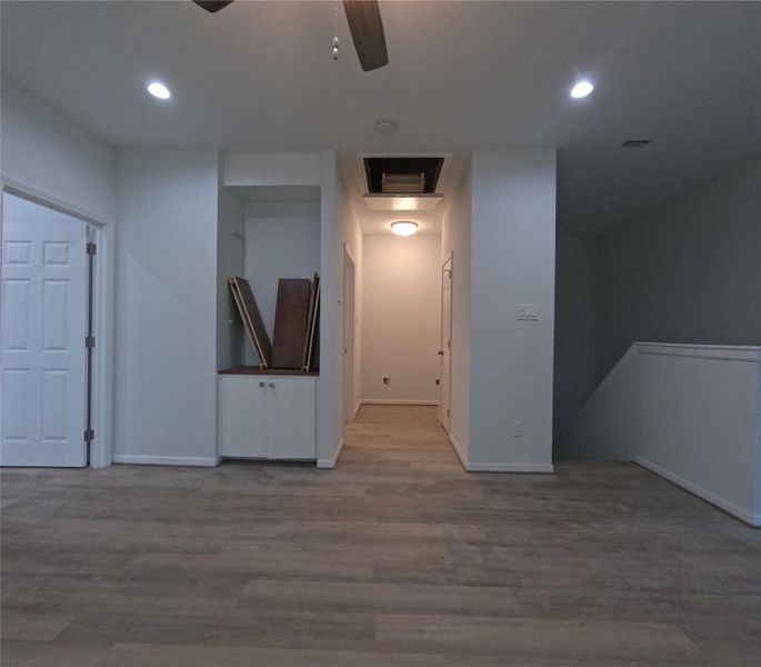 Upstairs Living Space looking towards Laundry Room and Desk Desk area