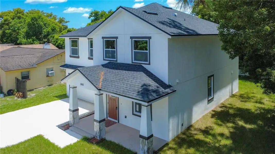 Front exterior of a new home in , Casselberry, FL, highlighting curb appeal (Image 2). Front exterior of a new home in , Casselberry, FL, highlighting curb appeal (Image 2).
