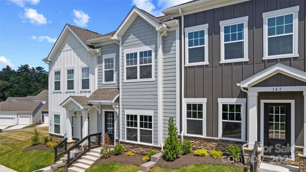 Front exterior of a new home in , Asheville, NC, highlighting curb appeal (Image 18).