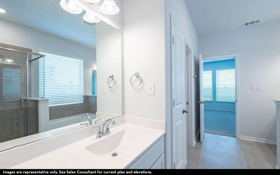 Additional vanity area with stylish fixtures and bright lighting, offering added functionality and convenience within the spacious primary bathroom suite. **Photos are representative only and may vary as built.** Additional vanity area with stylish fixtures and bright lighting, offering added functionality and convenience within the spacious primary bathroom suite. **Photos are representative only and may vary as built.**