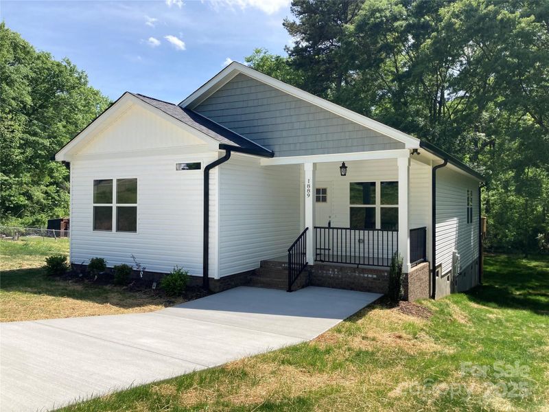 Front exterior of a new home in , Gastonia, NC, highlighting curb appeal (Image 13).