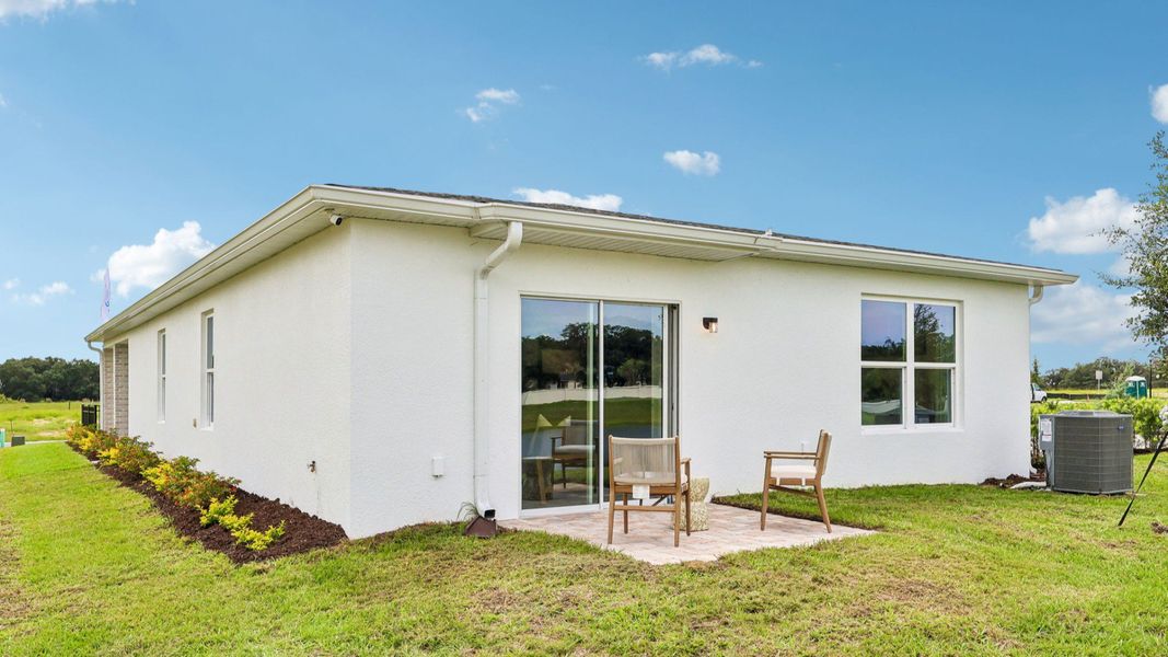 Representative exterior photo of a completed home built from the Flagler by DRB Homes in Hamilton Bluff, Haines City, FL (Image 25). Representative exterior photo of a completed home built from the Flagler by DRB Homes in Hamilton Bluff, Haines City, FL (Image 25).