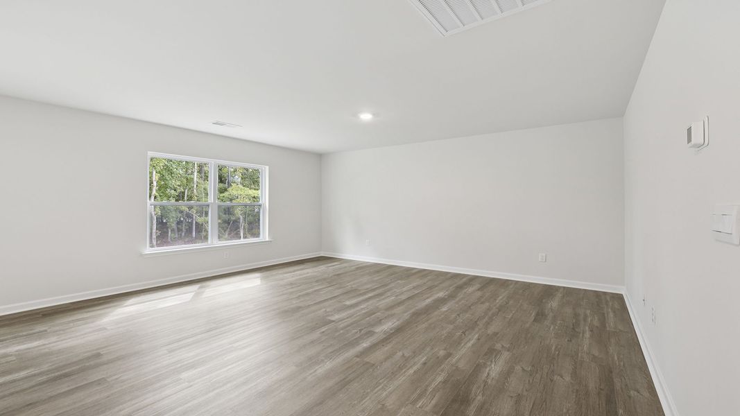 Spacious, unfurnished interior of a new home in Bentley Park, Greenwood (Image 21).