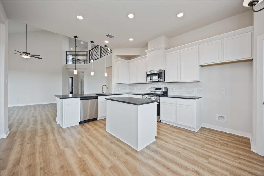 The separate kitchen and dining area offer functionality and style for your culinary endeavors and dining experiences. The separate kitchen and dining area offer functionality and style for your culinary endeavors and dining experiences.