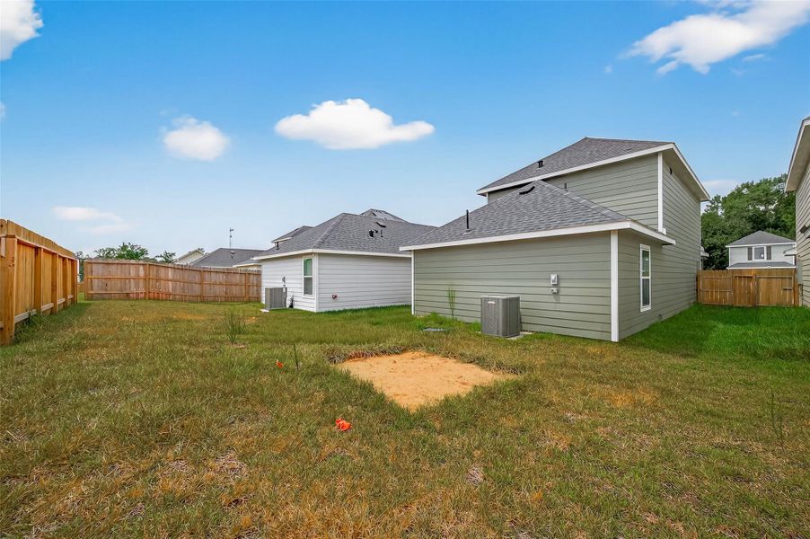 Front exterior of a new home in Marie Village, Conroe, TX, highlighting curb appeal (Image 17). Front exterior of a new home in Marie Village, Conroe, TX, highlighting curb appeal (Image 17).