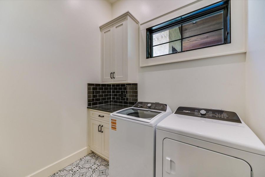Laundry area with washing machine and dryer and cabinet space