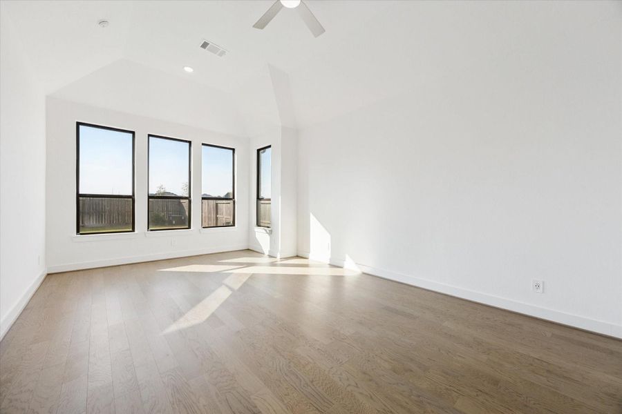 The primary suite also features the beautiful neutral colored hardwood floors, and there is an extension at the windows for you to be able to easily put a sitting area and chair chairs The primary suite also features the beautiful neutral colored hardwood floors, and there is an extension at the windows for you to be able to easily put a sitting area and chair chairs