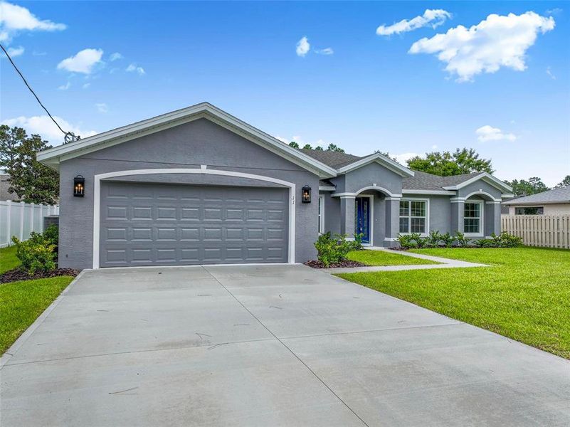 Front exterior of a new home in , Palm Coast, FL, highlighting curb appeal (Image 24).