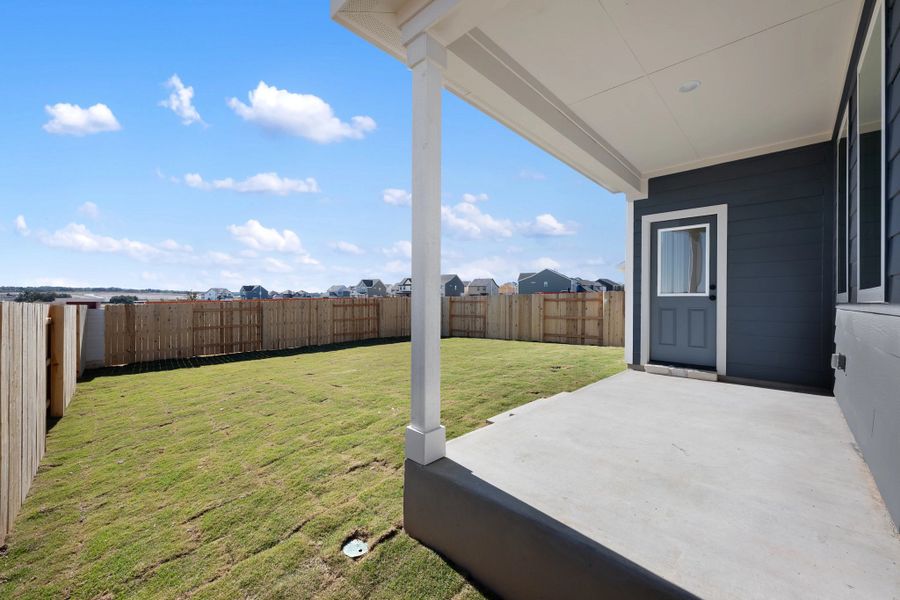 Exterior details and patio area of a home in The Homestead at Lariat, Liberty Hill (Image 29).
