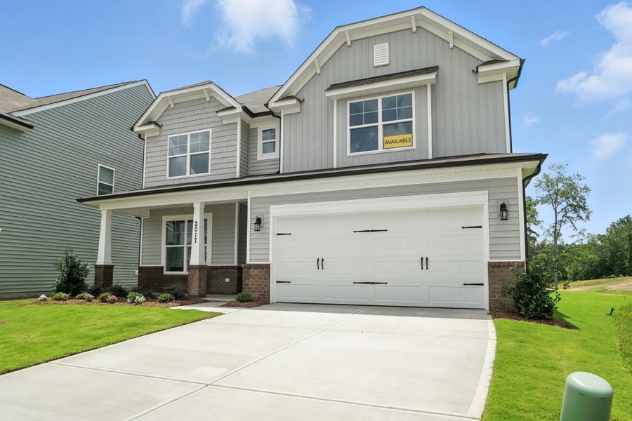 Front exterior of a new home in Hampton Woods, Charlotte, NC, highlighting curb appeal (Image 2). Front exterior of a new home in Hampton Woods, Charlotte, NC, highlighting curb appeal (Image 2).