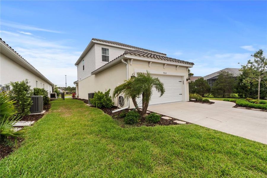 Front exterior of a new home in , Sarasota, FL, highlighting curb appeal (Image 24).