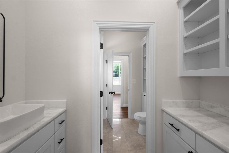 Bathroom featuring vanity and light tile patterned floors