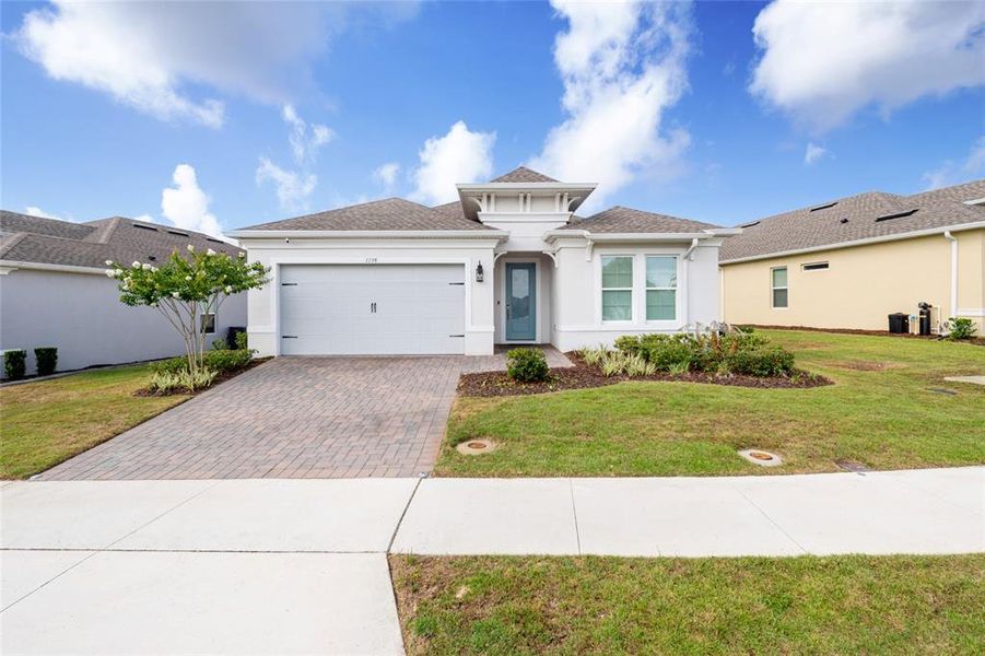 Front exterior of a new home in , Kissimmee, FL, highlighting curb appeal (Image 27). Front exterior of a new home in , Kissimmee, FL, highlighting curb appeal (Image 27).