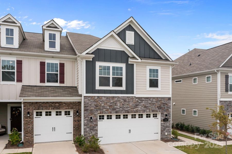 Front exterior of a new home in , Charlotte, NC, highlighting curb appeal (Image 1).