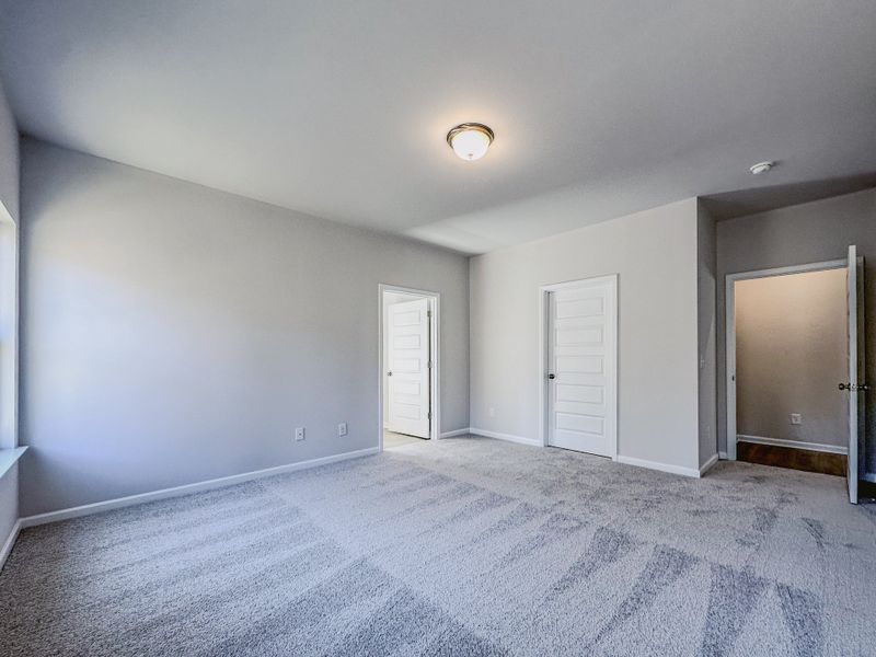 Representative unfurnished interior of a home built from the The Hampton by Smith Douglas Homes in Enclave at Willis, Willis (Image 24).