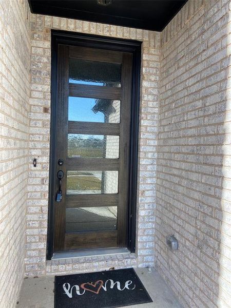 Elegant modern 8 ft mahogany front door welcomes guests Elegant modern 8 ft mahogany front door welcomes guests