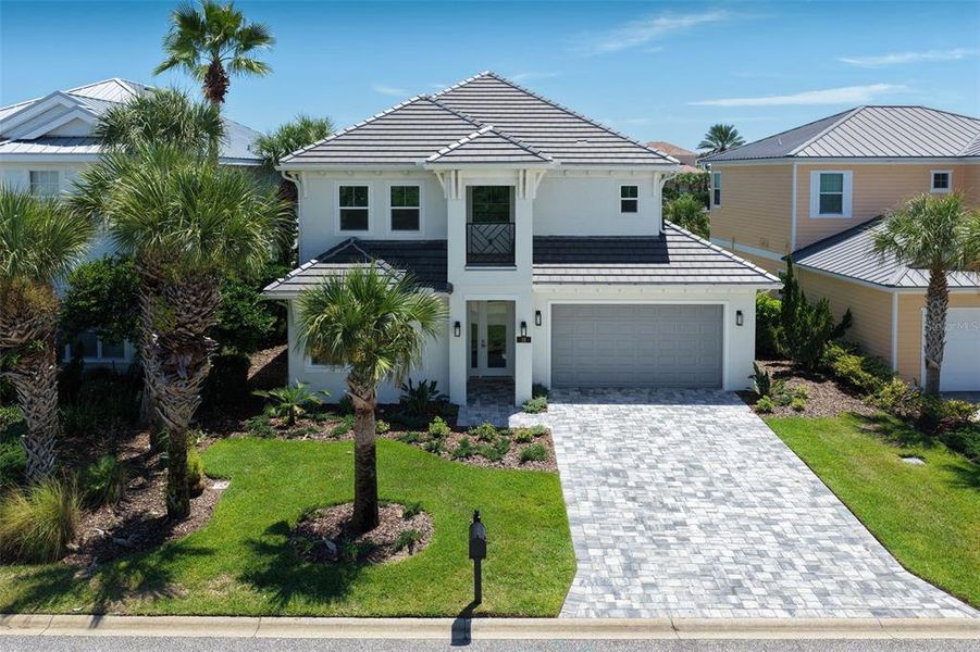 Front exterior of a new home in , Palm Coast, FL, highlighting curb appeal (Image 2). Front exterior of a new home in , Palm Coast, FL, highlighting curb appeal (Image 2).