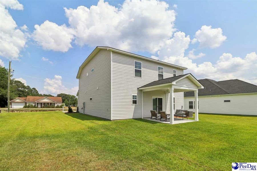 Front exterior of a new home in Southern Columns, Florence, SC, highlighting curb appeal (Image 31).