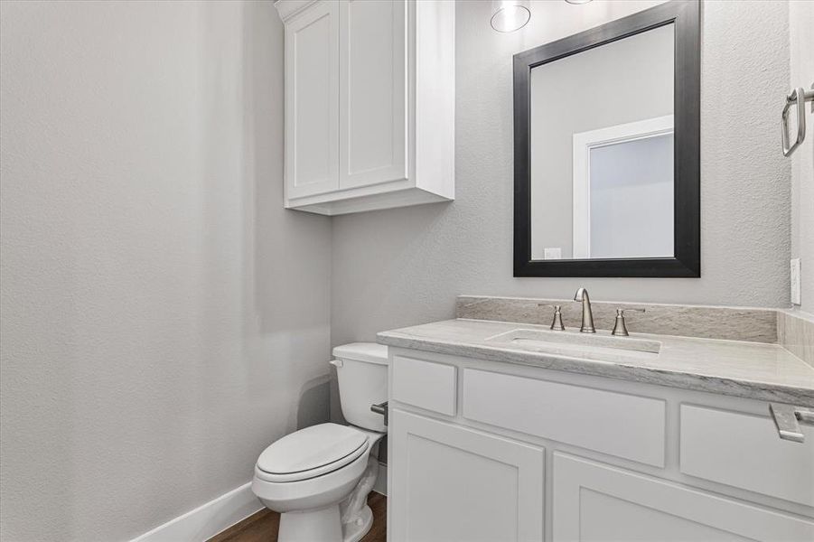 Bathroom with toilet and vanity