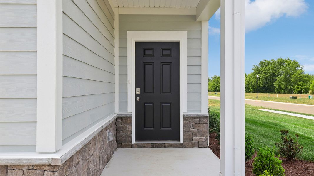 Front door to Juniper home with covered patio