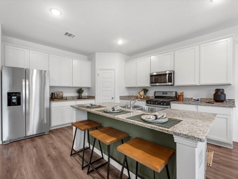 A kitchen with white cabinets. A kitchen with white cabinets.