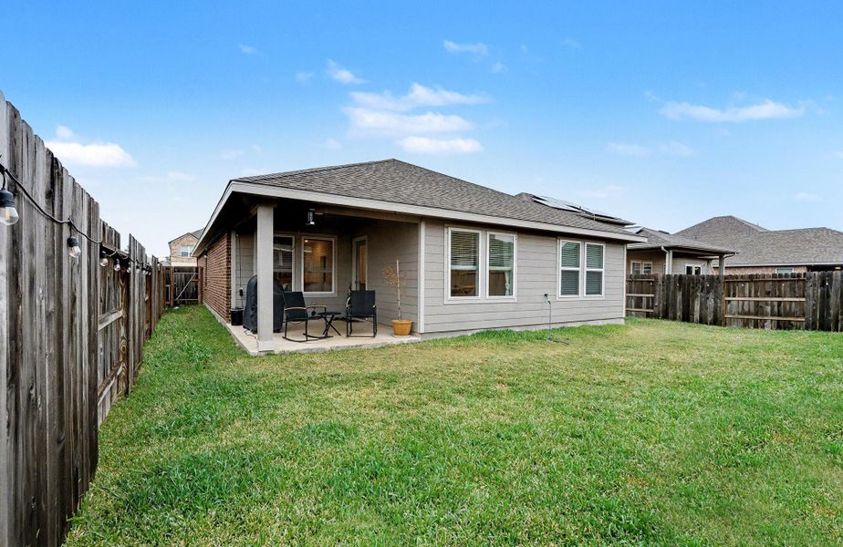 Exterior details and patio area of a home in Heights of Barbers Hill, Baytown (Image 4).