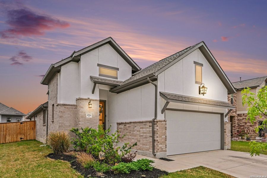 Front exterior of a new home in The Parklands, Schertz, TX, highlighting curb appeal (Image 23).