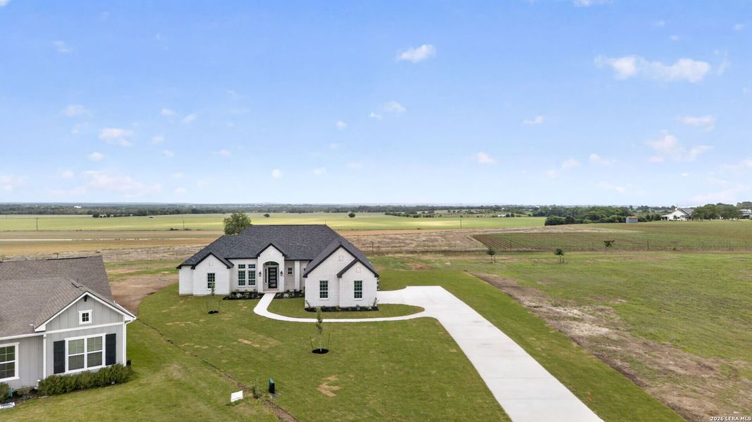 Front exterior of a new home in , Castroville, TX, highlighting curb appeal (Image 29).