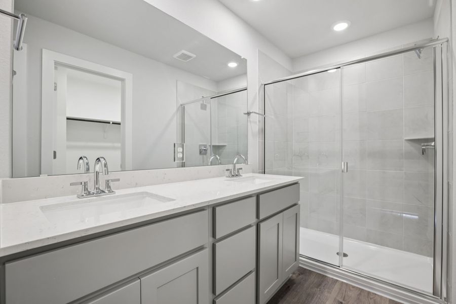 A bathroom with a glass shower.