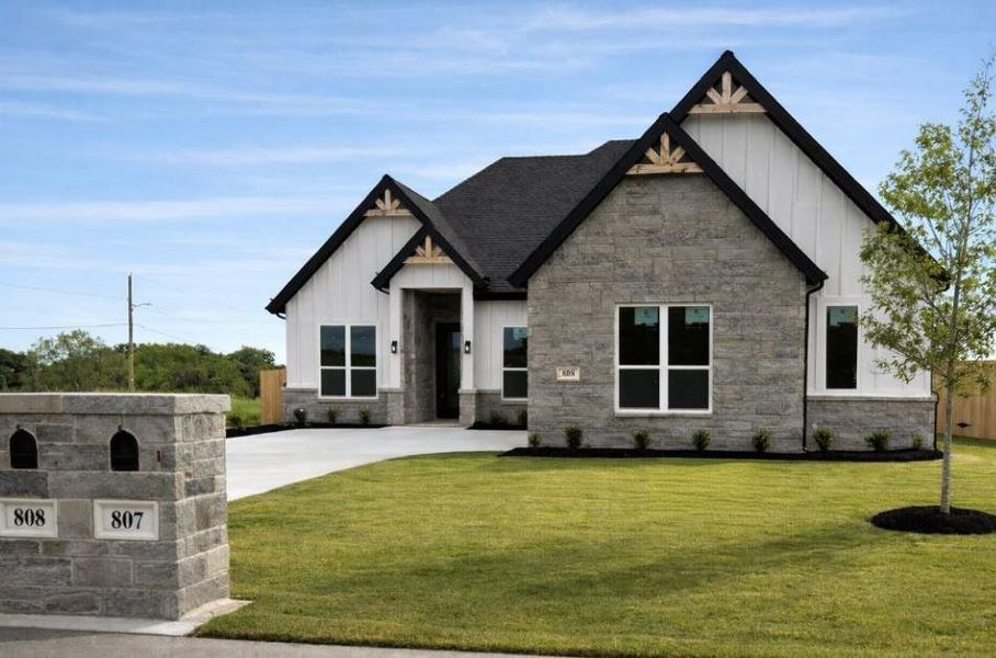 Front exterior of a new home in , Springtown, TX, highlighting curb appeal (Image 1). Front exterior of a new home in , Springtown, TX, highlighting curb appeal (Image 1).