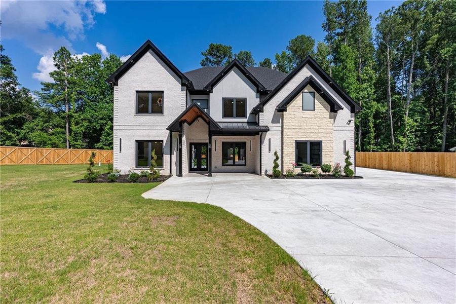 Front exterior of a new home in , Lawrenceville, GA, highlighting curb appeal (Image 49). Front exterior of a new home in , Lawrenceville, GA, highlighting curb appeal (Image 49).