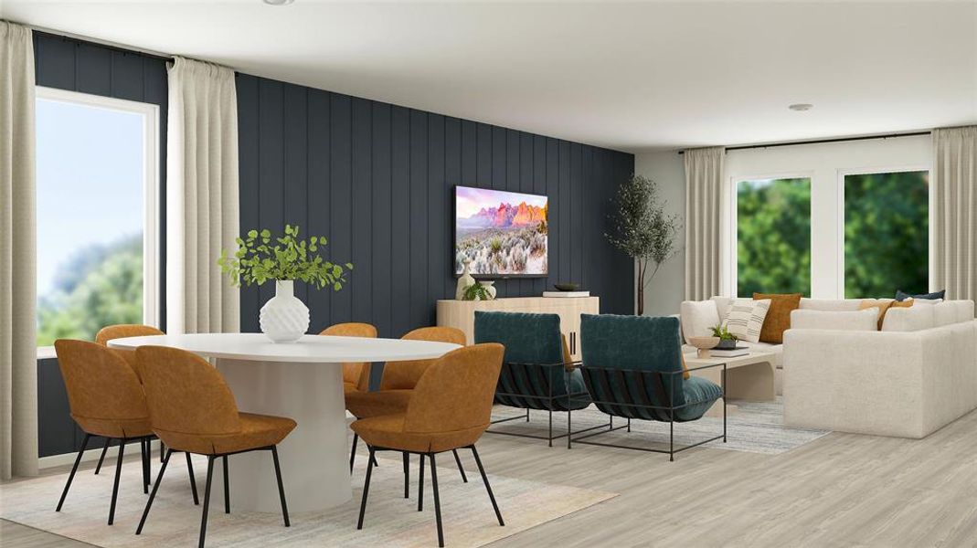 Dining area with wood finished floors, plenty of natural light, and wooden walls