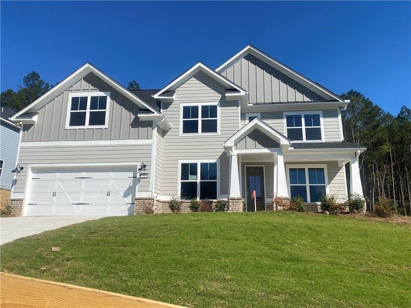 Front exterior of a new home in , Dallas, GA, highlighting curb appeal (Image 21).