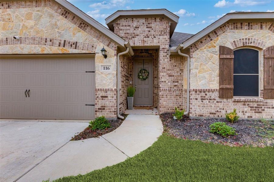 Entrance to property featuring a garage