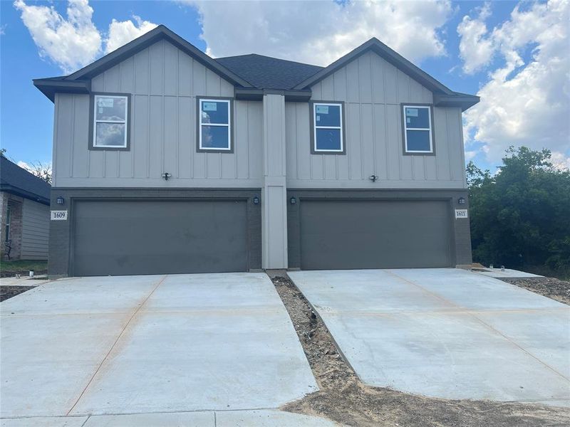 View of front of property with a garage