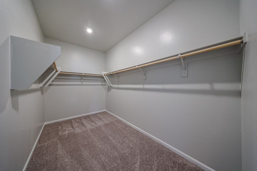A hallway with a metal railing.