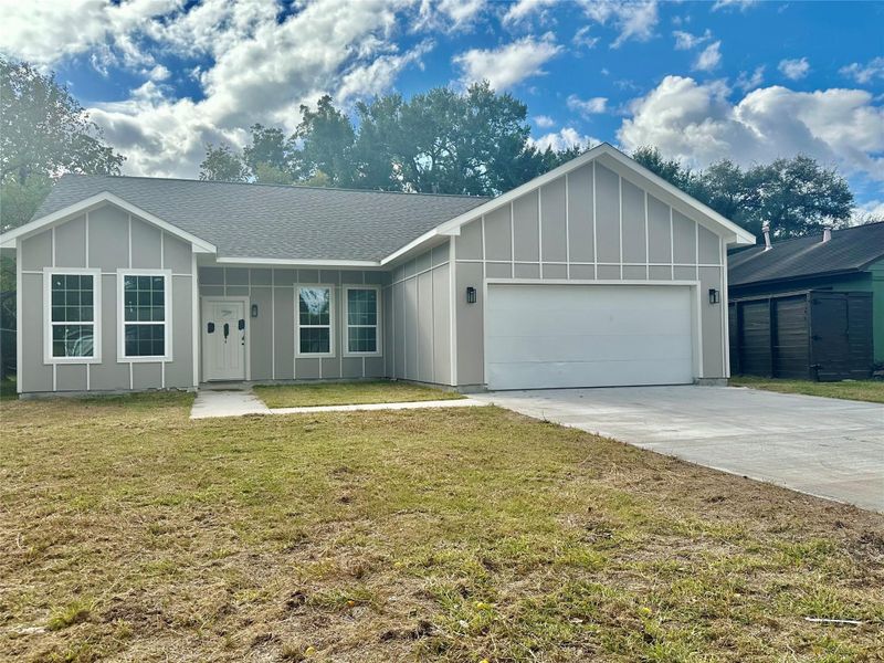 Front exterior of a new home in , Houston, TX, highlighting curb appeal (Image 1).