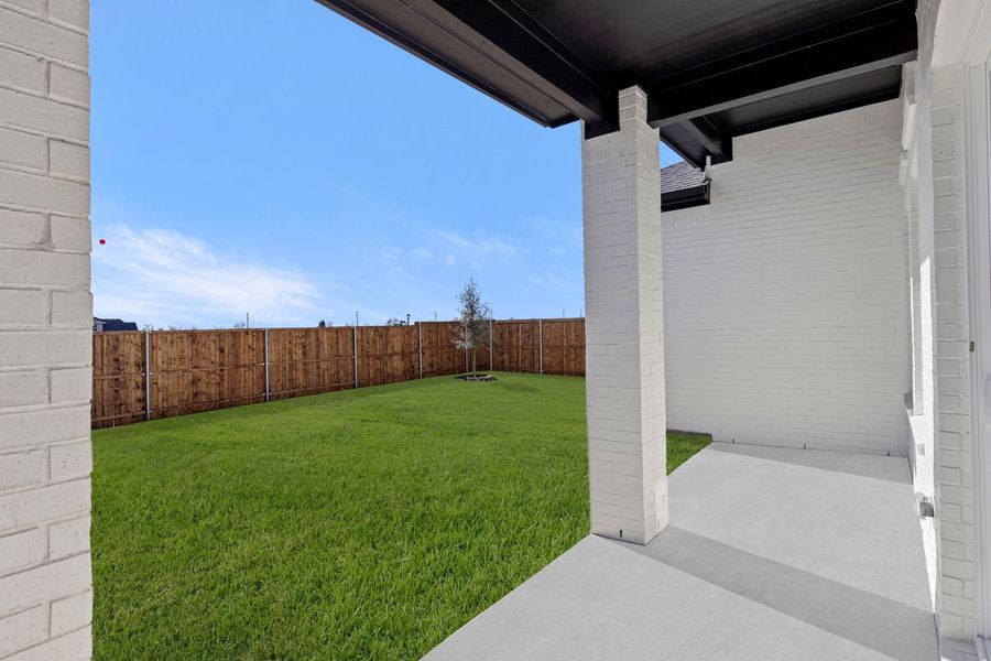 Exterior details and patio area of a home in Lily Creek at Sutton Fields, Aubrey (Image 2). Exterior details and patio area of a home in Lily Creek at Sutton Fields, Aubrey (Image 2).