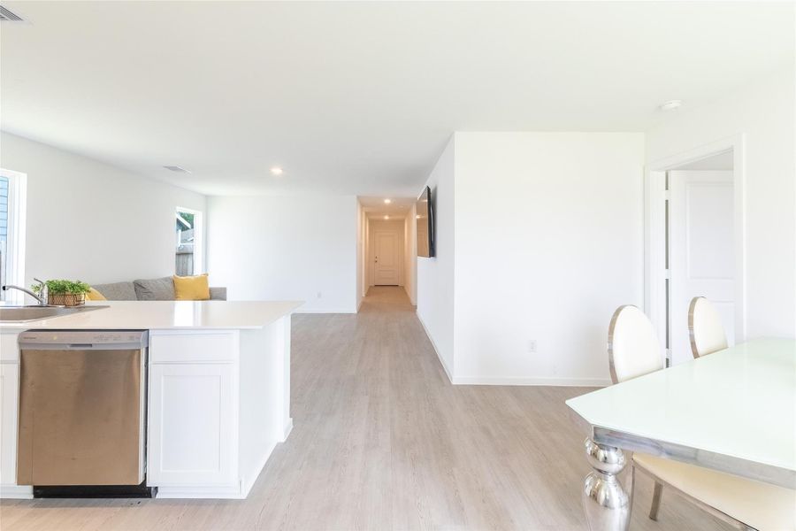 The open-concept layout creates the perfect space for gathering with family and friends. The open-concept layout creates the perfect space for gathering with family and friends.