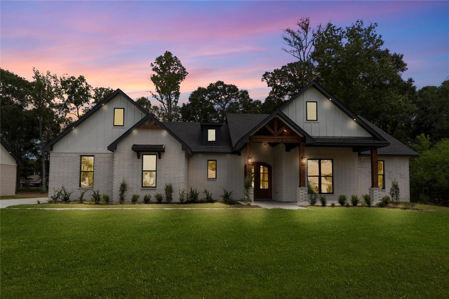Front exterior of a new home in , Dayton, TX, highlighting curb appeal (Image 26).