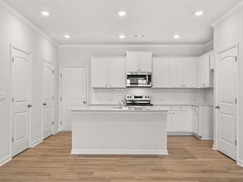 Furnished interior view inside a new home in Waypoint, Flowery Branch (Image 6).