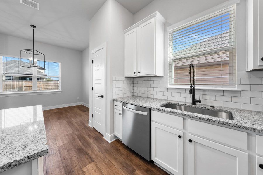 Furnished interior view inside a new home in TRACE, San Marcos (Image 6).