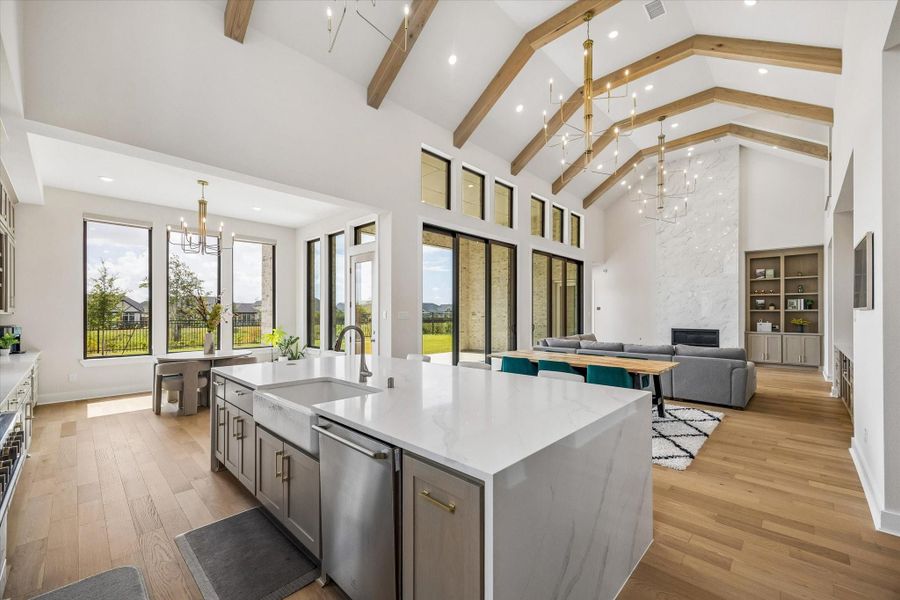 THIS VIEW HIGHLIGHTS THE SEAMLESS FLOW BETWEEN THE KITCHEN, BREAKFAST AREA, AND LIVING SPACE. A WALL OF TALL WINDOWS AND SLIDING GLASS DOORS BRINGS IN NATURAL LIGHT AND FRAMES THE BACKYARD. THIS VIEW HIGHLIGHTS THE SEAMLESS FLOW BETWEEN THE KITCHEN, BREAKFAST AREA, AND LIVING SPACE. A WALL OF TALL WINDOWS AND SLIDING GLASS DOORS BRINGS IN NATURAL LIGHT AND FRAMES THE BACKYARD.