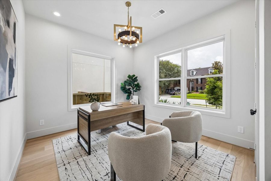 A private home office with a large window bring in lots of natural light offers a quiet, polished space for work, study, or everyday organization. A private home office with a large window bring in lots of natural light offers a quiet, polished space for work, study, or everyday organization.