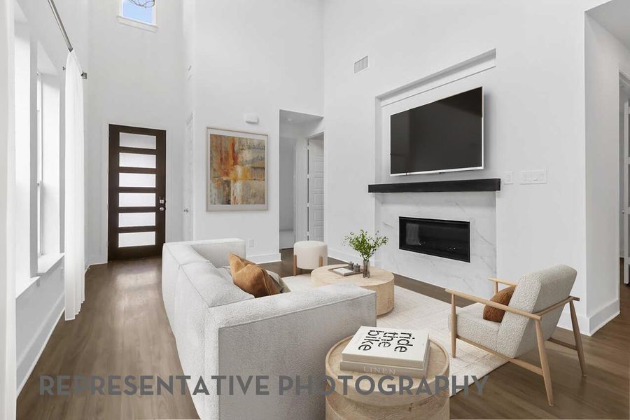 The family room boasts high ceilings and abundant sunlight, creating a warm, open space perfect for gathering and relaxing.