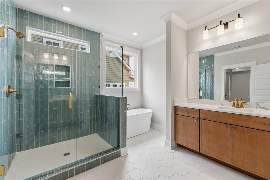 This primary bathroom features a spacious shower a