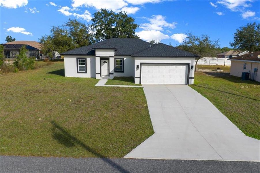 Front exterior of a new home in , Ocala, FL, highlighting curb appeal (Image 28).