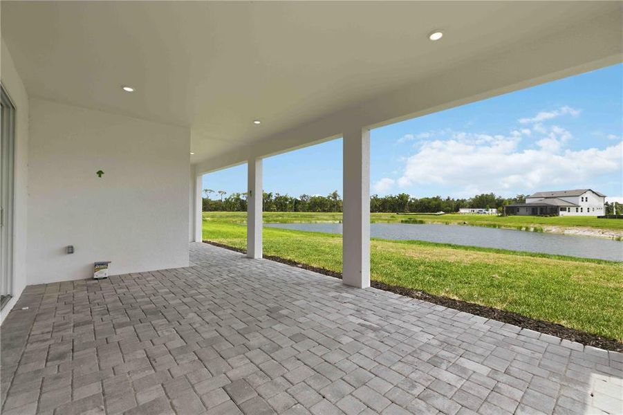 Exterior details and patio area of a home in Creeks Edge at Twin Rivers, Parrish (Image 31).