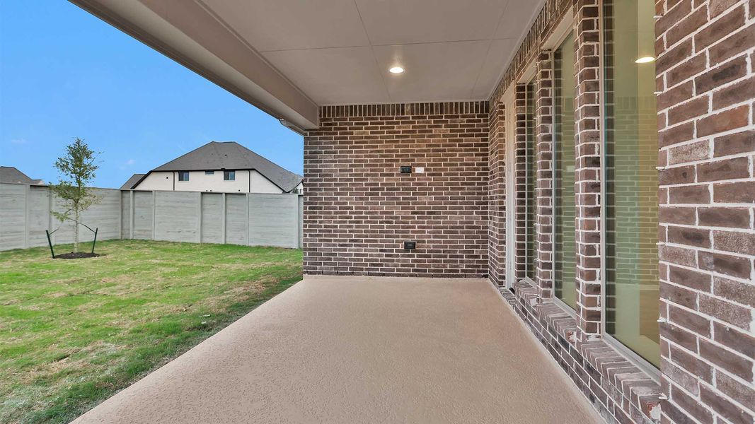 Exterior details and patio area of a home in Legacy 50', League City (Image 3).